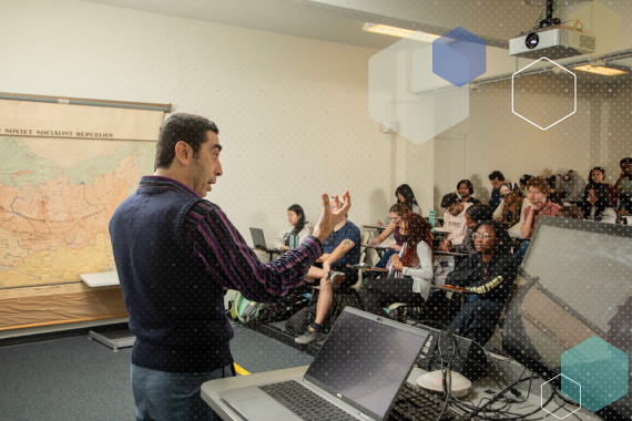 Faculty member teaching class. 