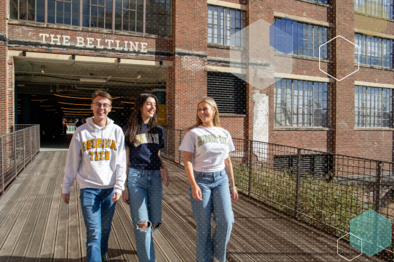 Students in Georgia Tech swag walking along the Atlanta Beltline.